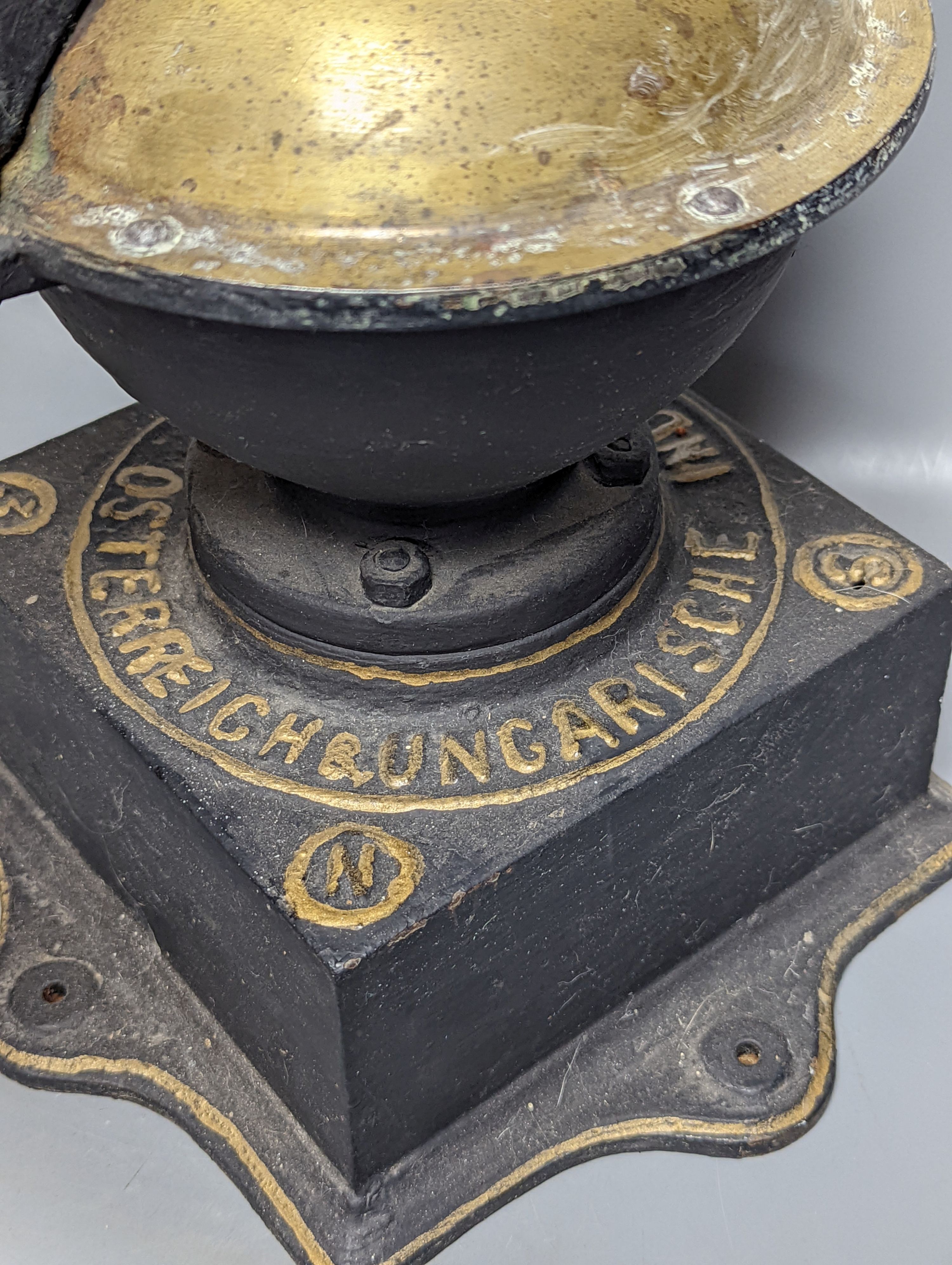 An Austrian cast iron and copper coffee grinder 45cm